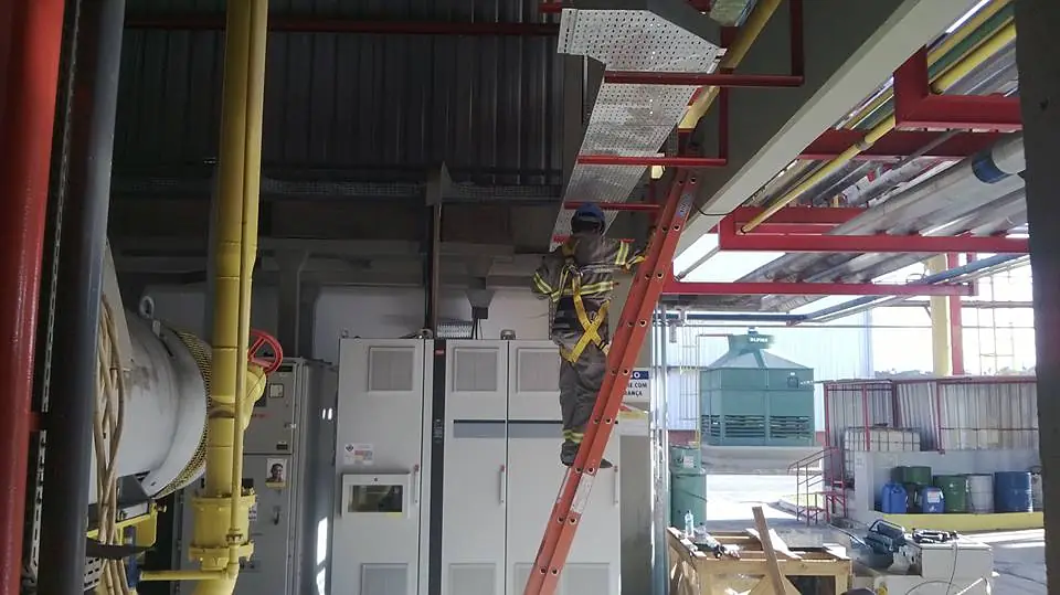 Technician working at height on an industrial site